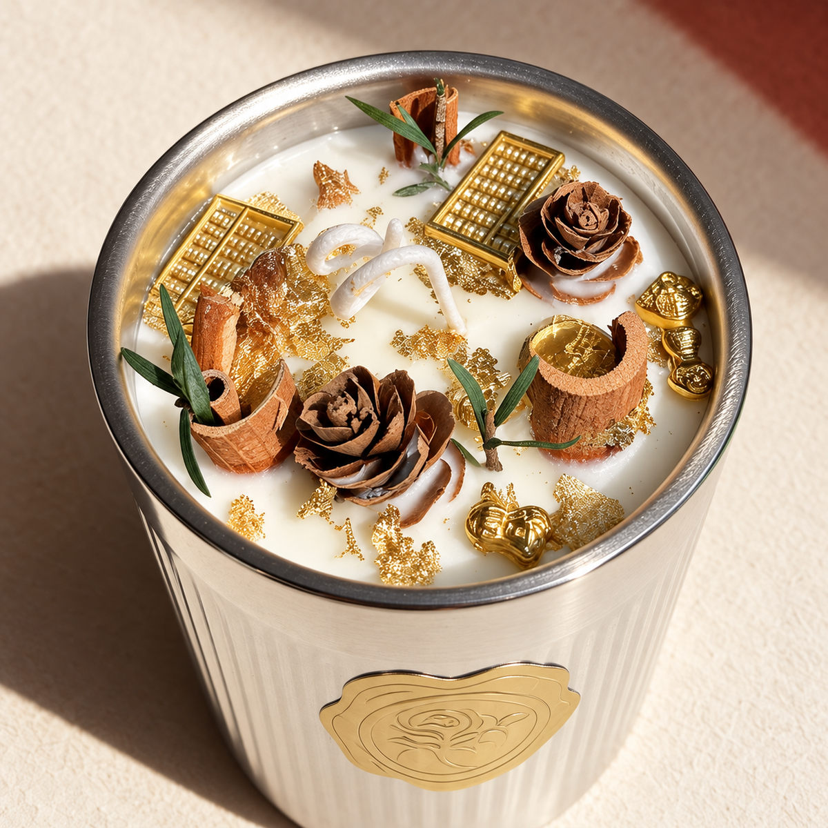 Close view of cinnamon candle surface and gold details